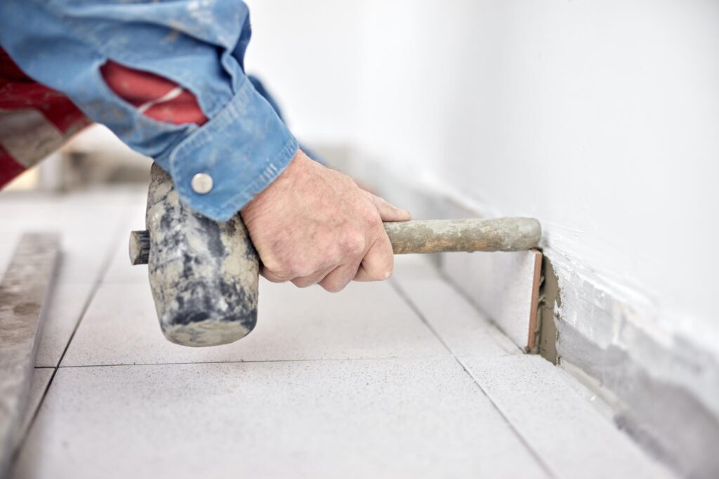 Professional placing tile | Bram Flooring